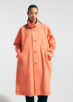 A model wears the A-POC ABLE ISSEY MIYAKE TYPE T 001 1 coat.
