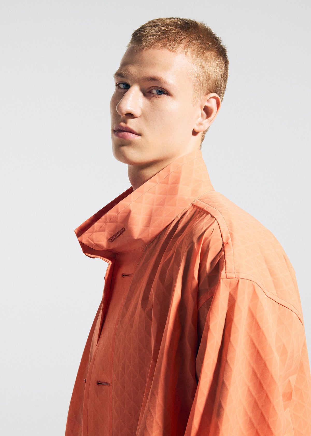 A model wears the A-POC ABLE ISSEY MIYAKE TYPE T 001 1 coat.