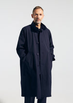 A model wears the A-POC ABLE ISSEY MIYAKE TYPE T 001 1 coat.