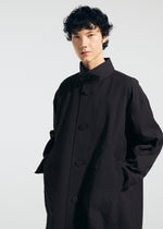 A model wears the A-POC ABLE ISSEY MIYAKE TYPE T 001 1 coat.