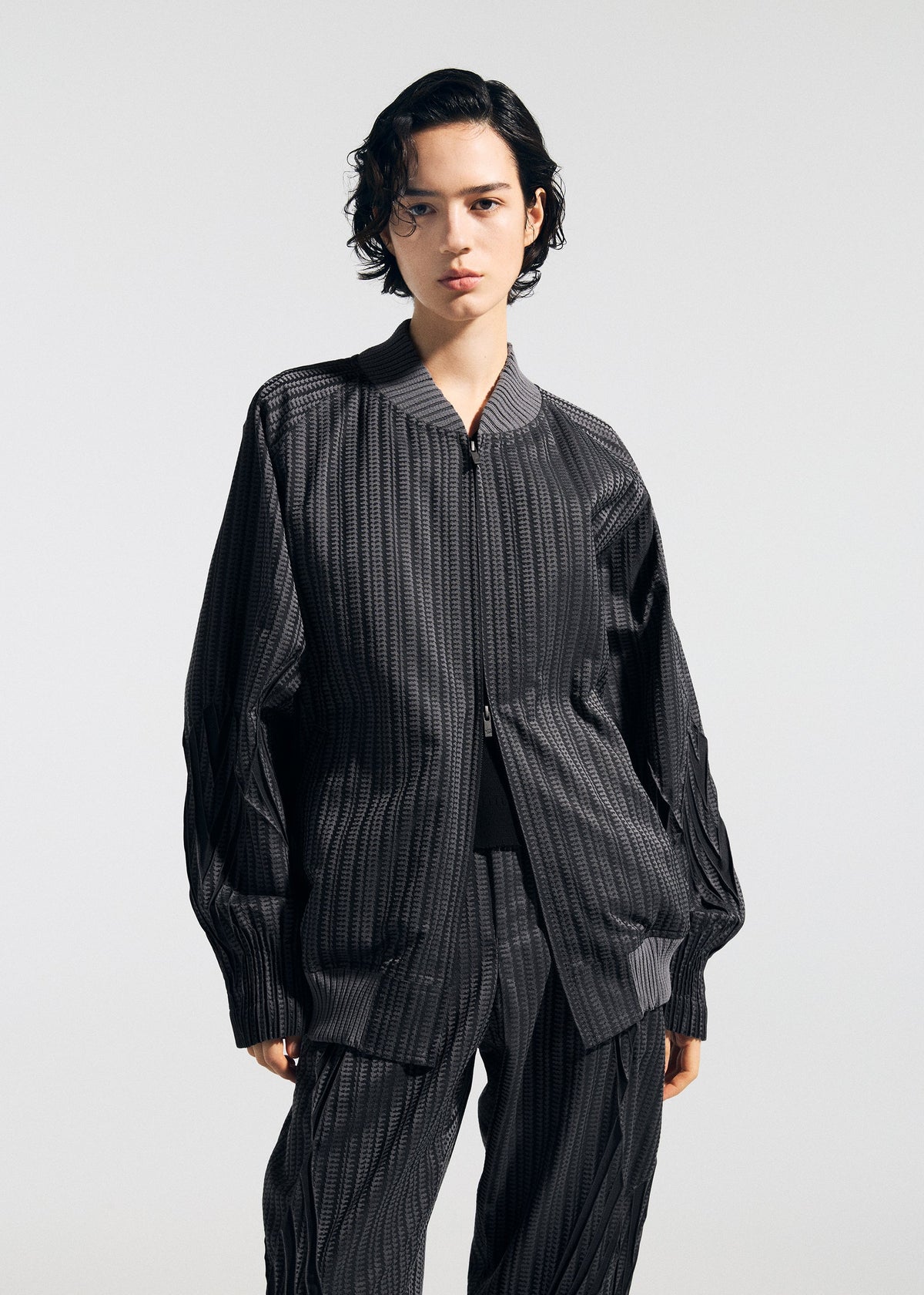 A model wears the A-POC ABLE ISSEY MIYAKE TYPE S 001 1 jacket.