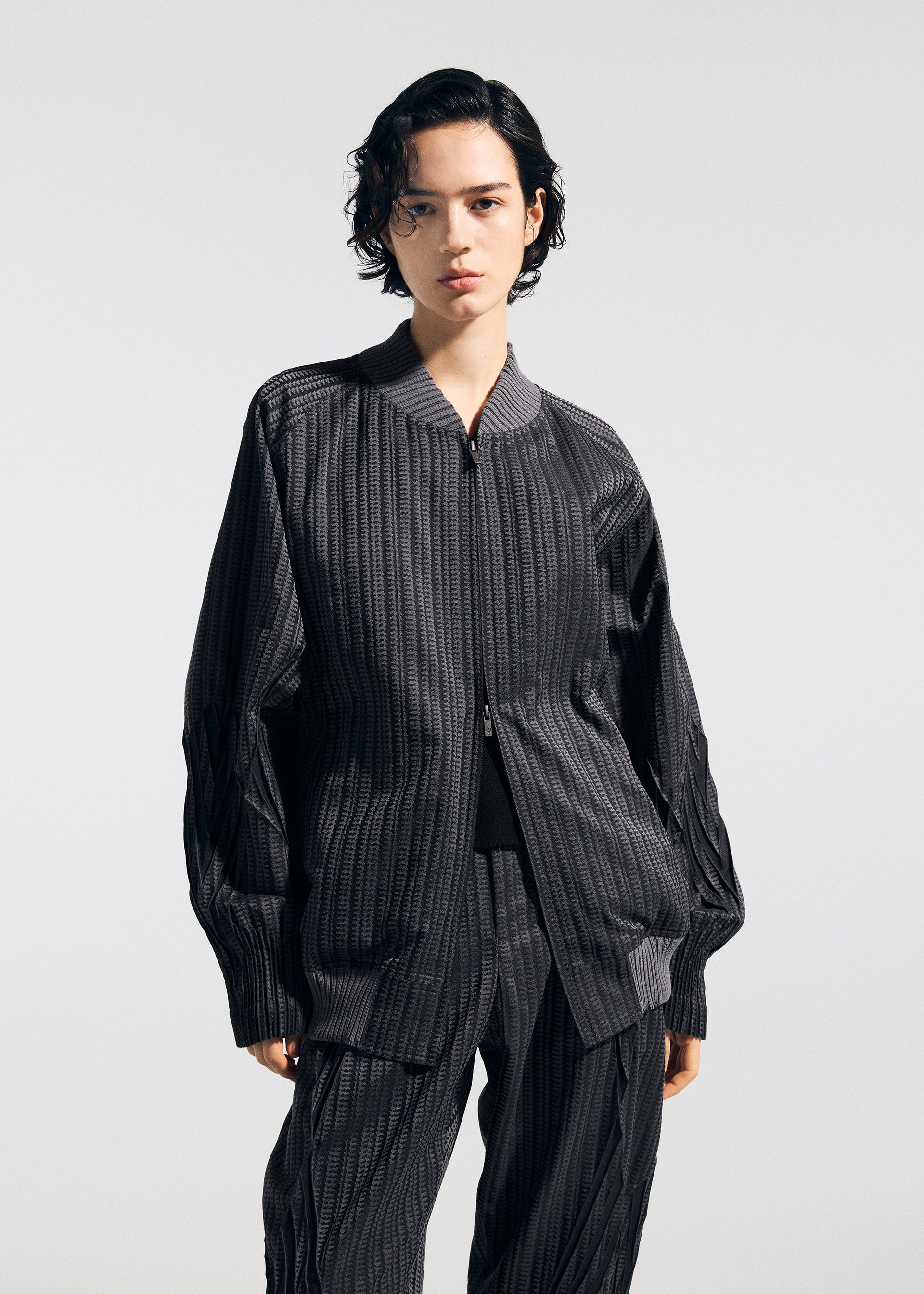 A model wears the A-POC ABLE ISSEY MIYAKE TYPE S 001 1 jacket.