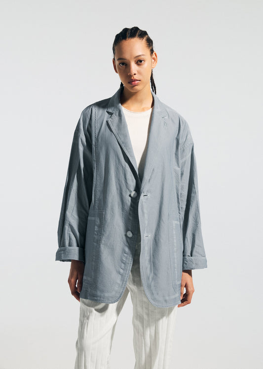 A model wears the A-POC ABLE ISSEY MIYAKE TYPE U 002 jacket.