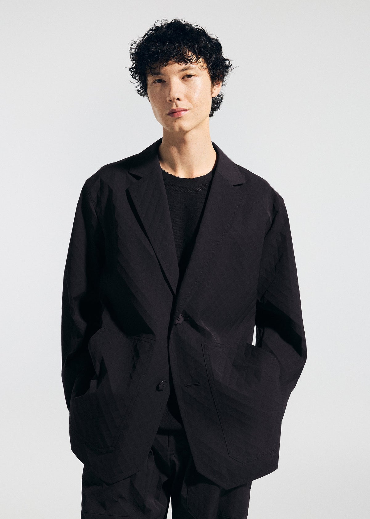 A model wears the A-POC ABLE ISSEY MIYAKE TYPE T 001 2 jacket.
