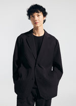 A model wears the A-POC ABLE ISSEY MIYAKE TYPE T 001 2 jacket.