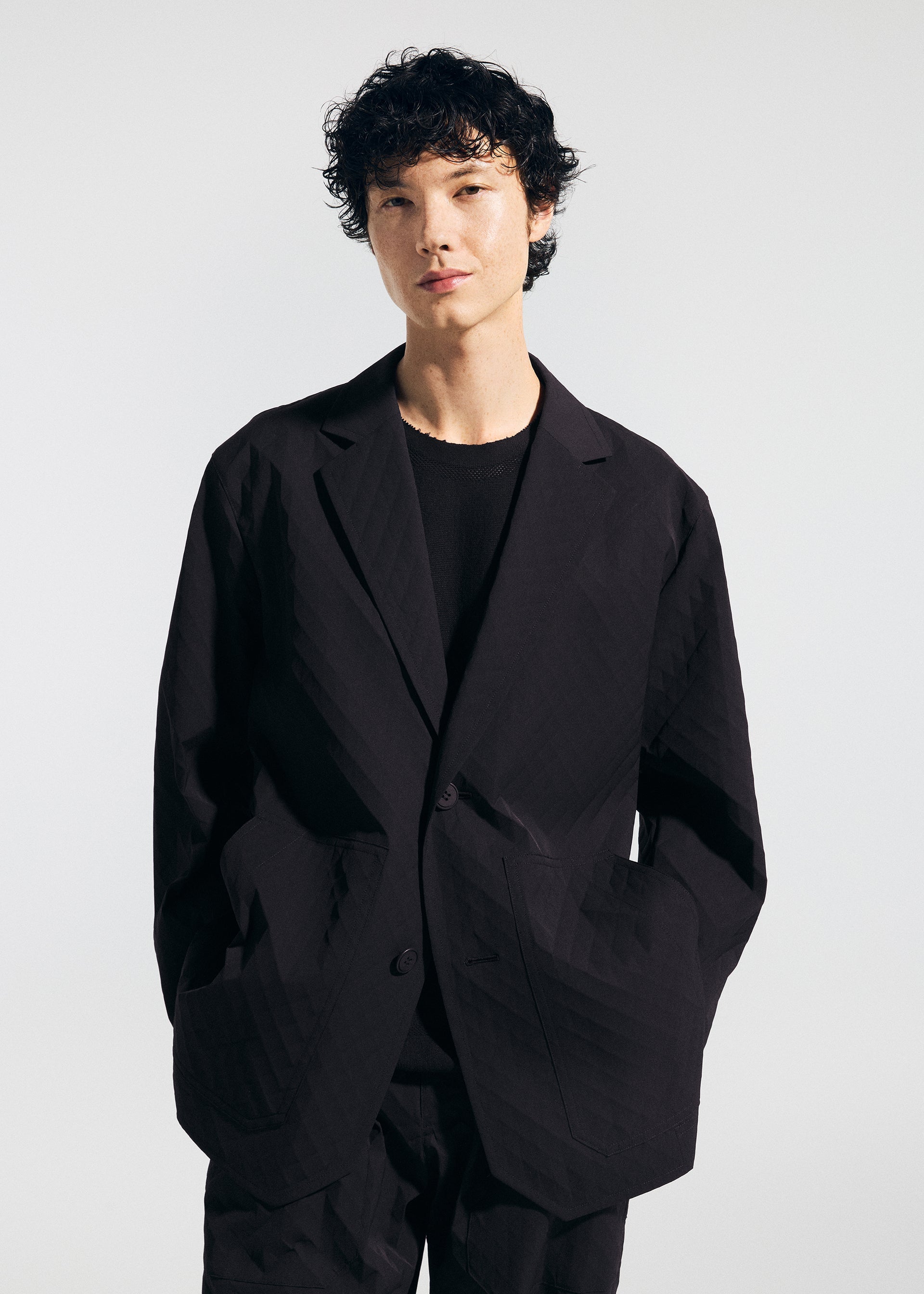 A model wears the A-POC ABLE ISSEY MIYAKE TYPE T 001 2 jacket.