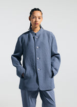 A model wears the A-POC ABLE ISSEY MIYAKE TYPE-O 014 type-o-014-jacket-steel-blue.