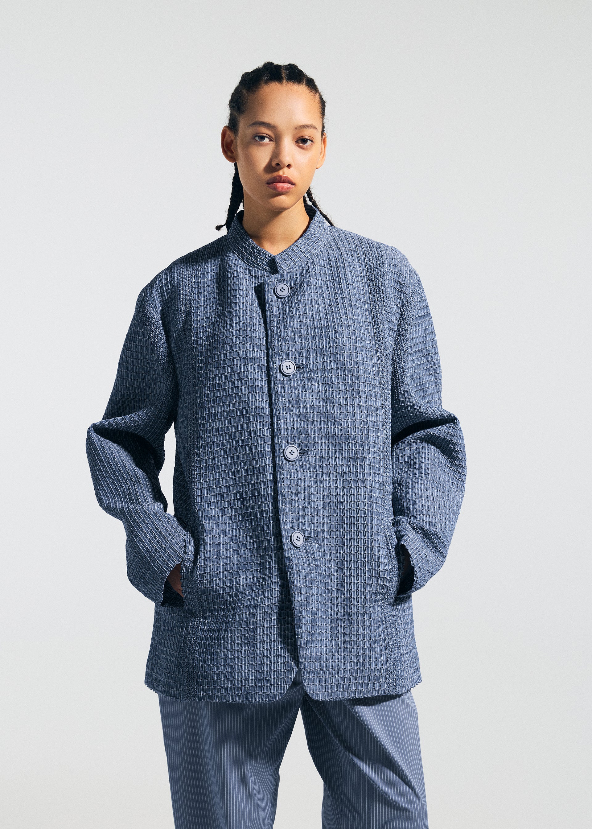 A model wears the A-POC ABLE ISSEY MIYAKE TYPE-O 014 type-o-014-jacket-steel-blue.