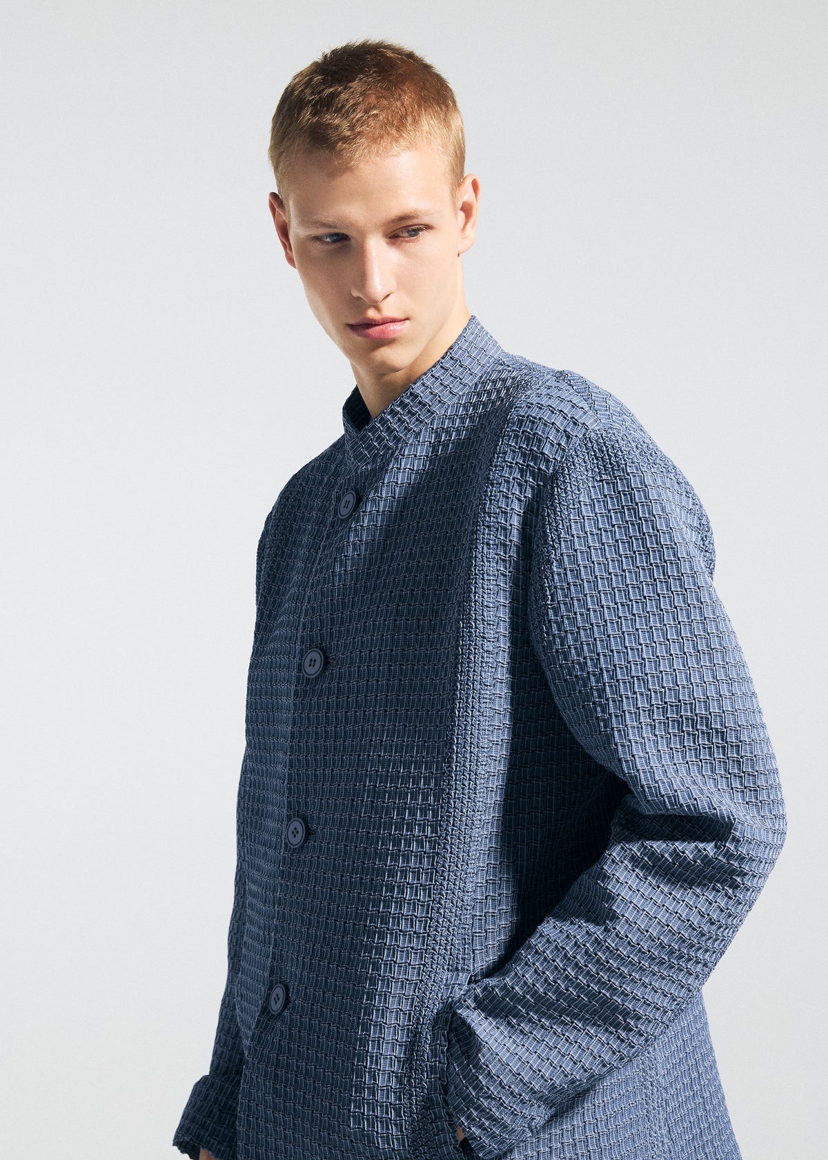 A model wears the A-POC ABLE ISSEY MIYAKE TYPE-O 014 type-o-014-jacket-steel-blue.
