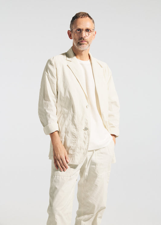 A model wears the A-POC ABLE ISSEY MIYAKE TYPE-U 001 type-u-001-trousers-ivory.