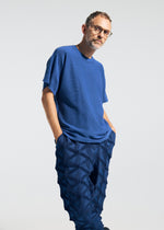 A model wears the A-POC ABLE ISSEY MIYAKE TYPE-O 023 type-o-023-trousers-black.