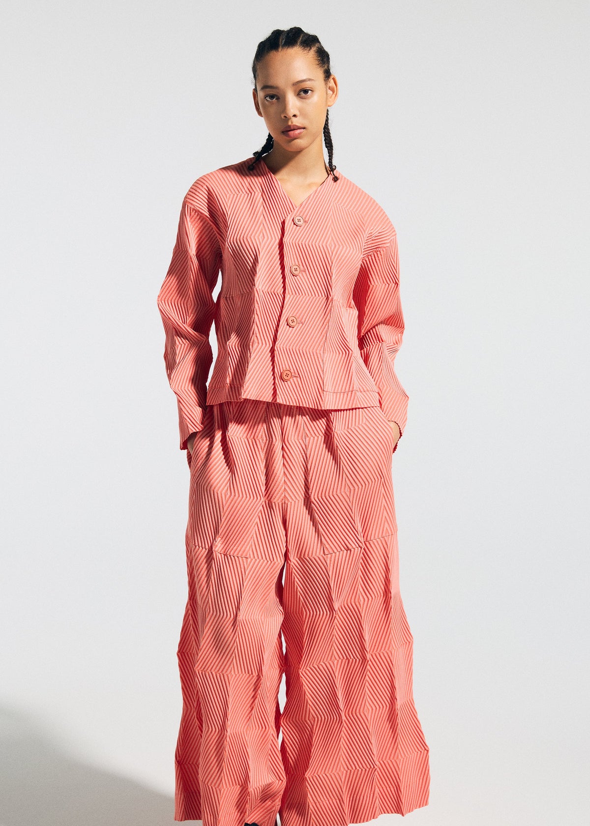 A model wears the A-POC ABLE ISSEY MIYAKE TYPE W 009 1 trousers.
