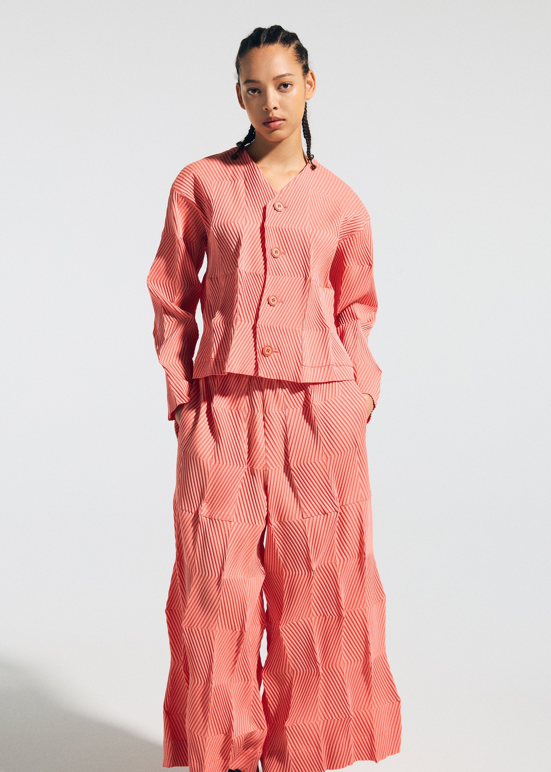 A model wears the A-POC ABLE ISSEY MIYAKE TYPE W 009 1 trousers.