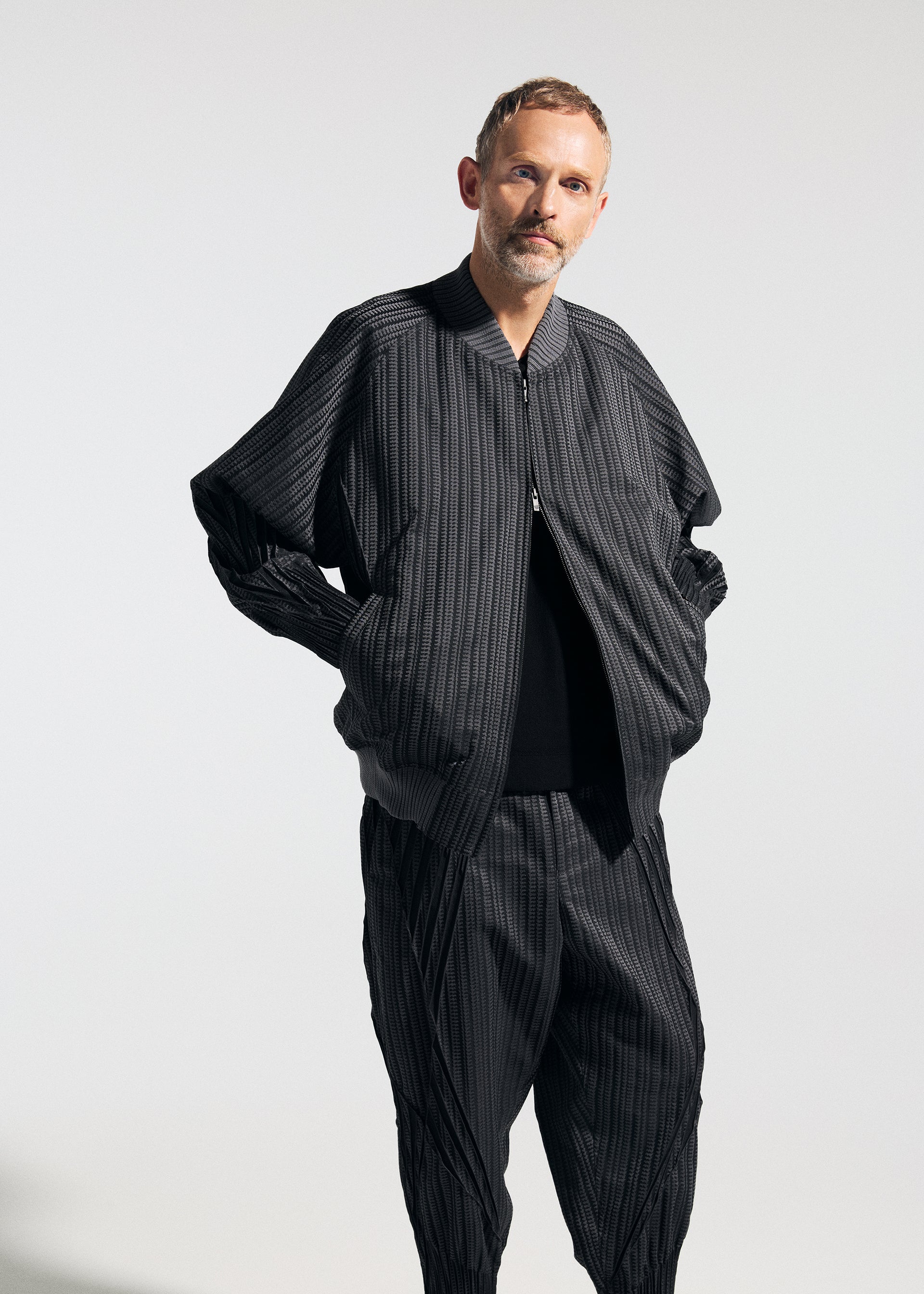 A model wears the A-POC ABLE ISSEY MIYAKE TYPE S 001 1 trousers.