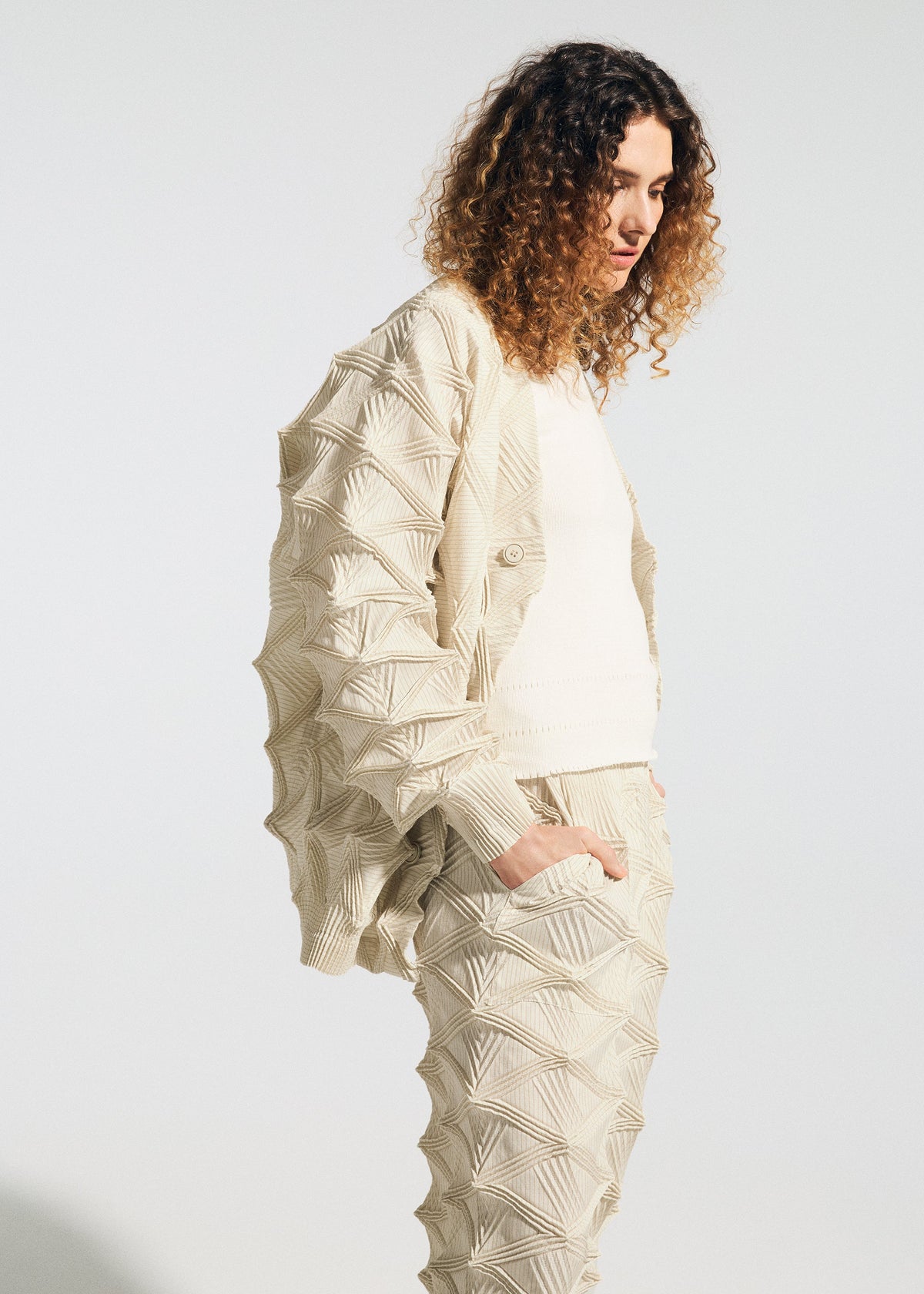 A model wears the A-POC ABLE ISSEY MIYAKE TYPE-O 023 type-o-023-cardigan-black.