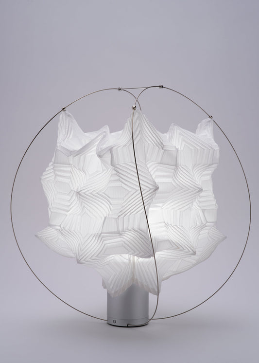 A detail shot of the A-POC ABLE ISSEY MIYAKE TYPE XIII Atelier Oï project lamp.
