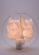 A detail shot of the A-POC ABLE ISSEY MIYAKE TYPE XIII Atelier Oï project lamp.