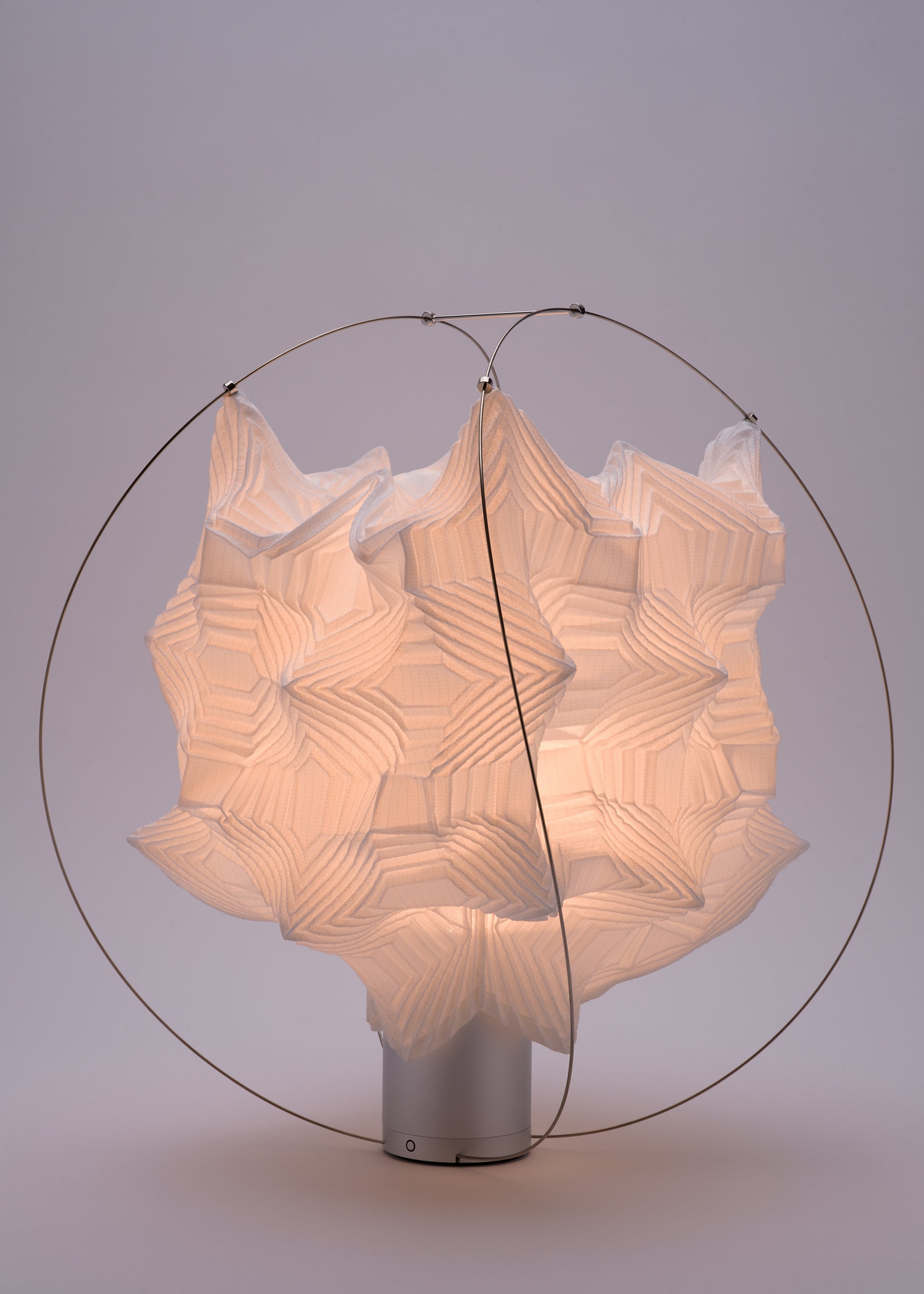 A detail shot of the A-POC ABLE ISSEY MIYAKE TYPE XIII Atelier Oï project lamp.