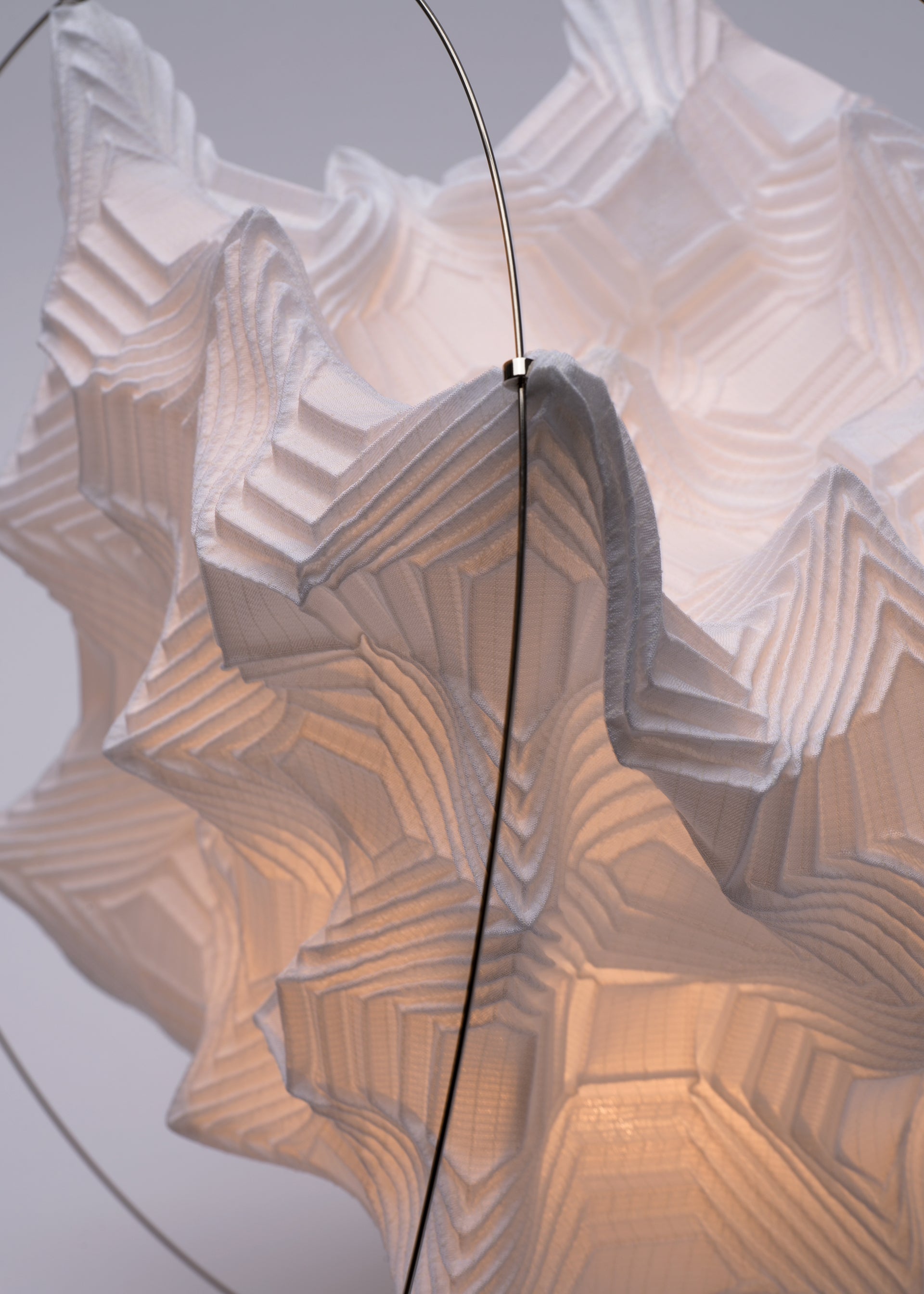 A detail shot of the A-POC ABLE ISSEY MIYAKE TYPE XIII Atelier Oï project lamp.