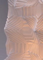 A detail shot of the A-POC ABLE ISSEY MIYAKE TYPE XIII Atelier Oï project lamp.