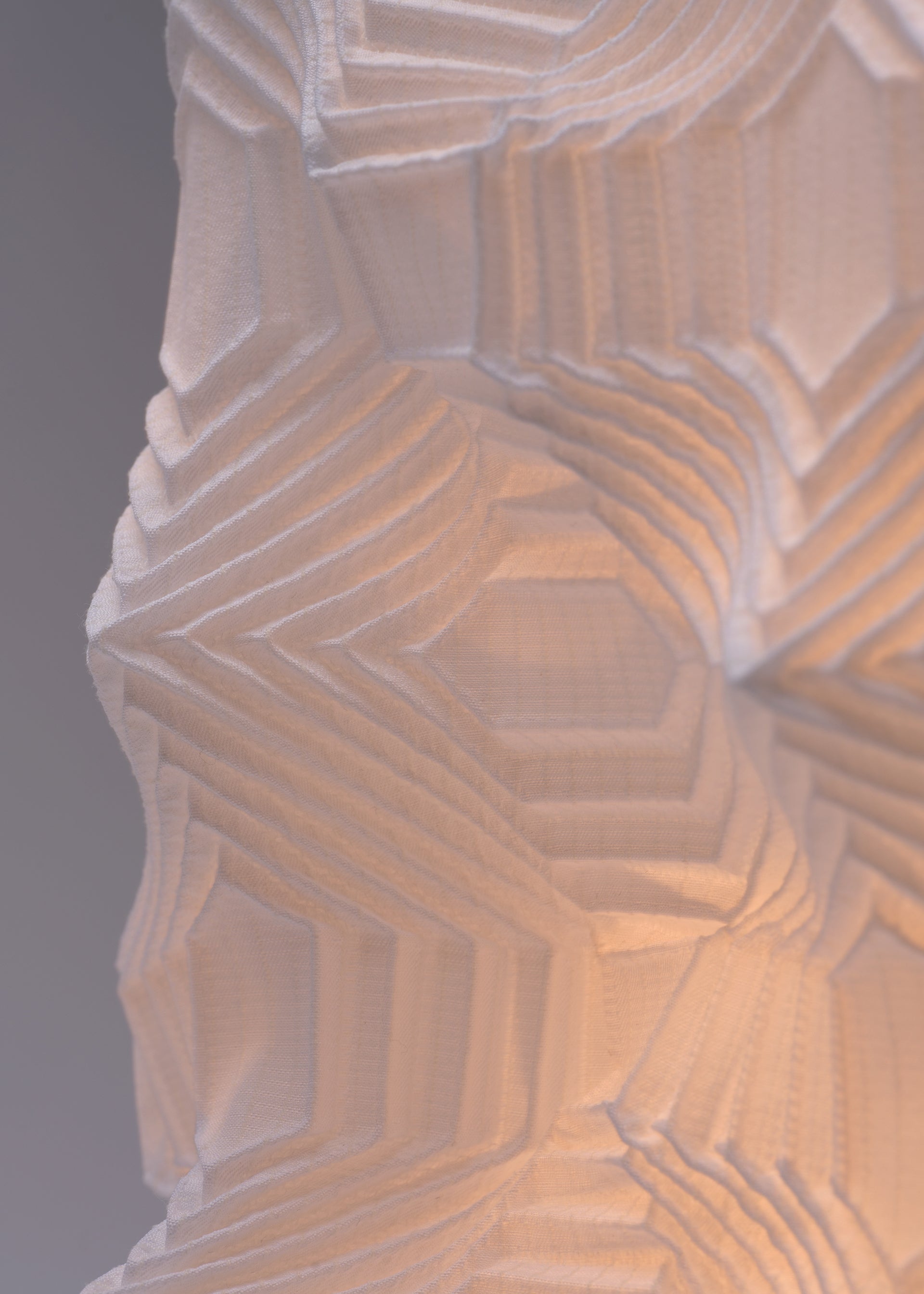 A detail shot of the A-POC ABLE ISSEY MIYAKE TYPE XIII Atelier Oï project lamp.