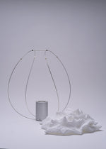 A detail shot of the A-POC ABLE ISSEY MIYAKE TYPE XIII Atelier Oï project lamp.