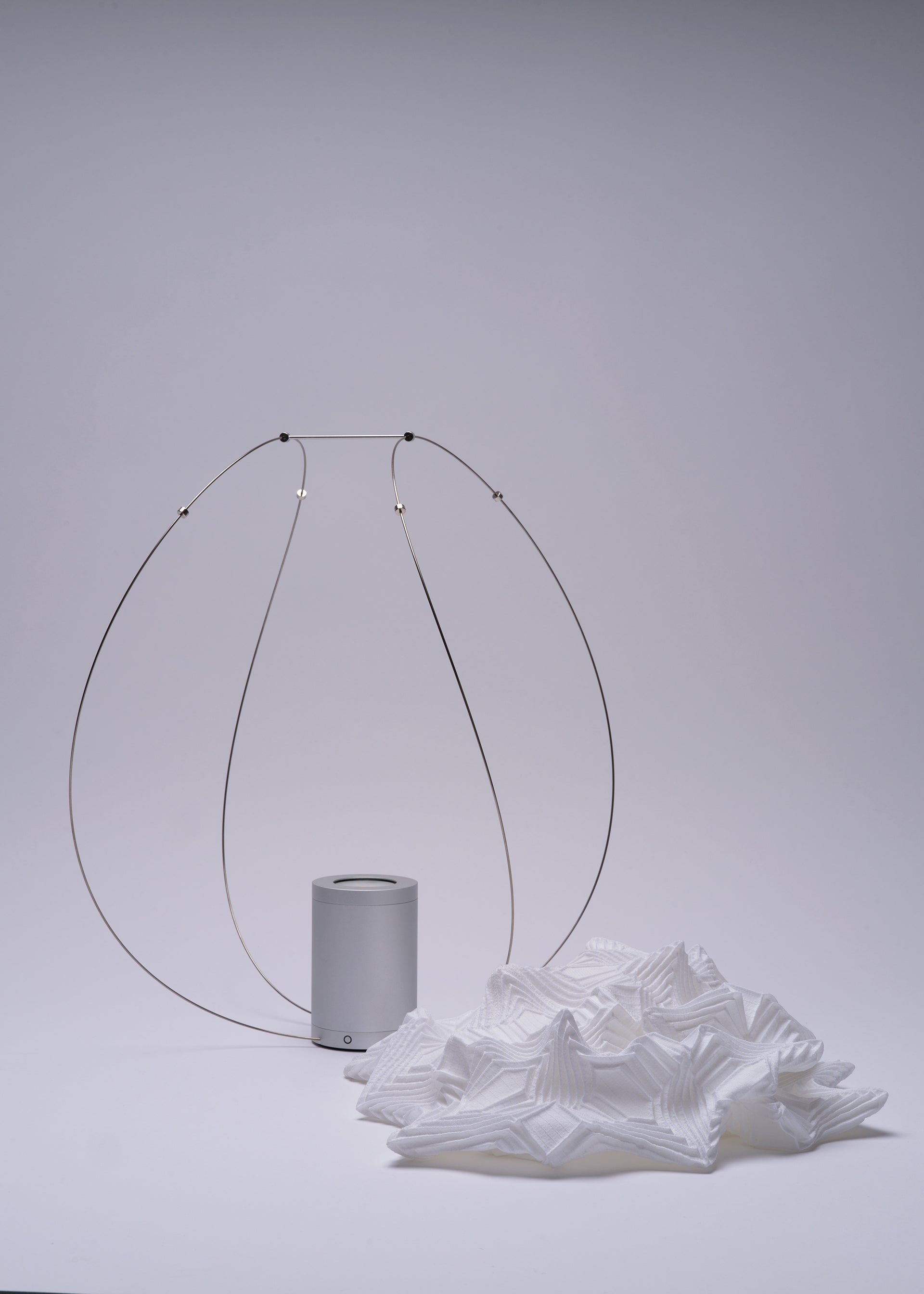 A detail shot of the A-POC ABLE ISSEY MIYAKE TYPE XIII Atelier Oï project lamp.