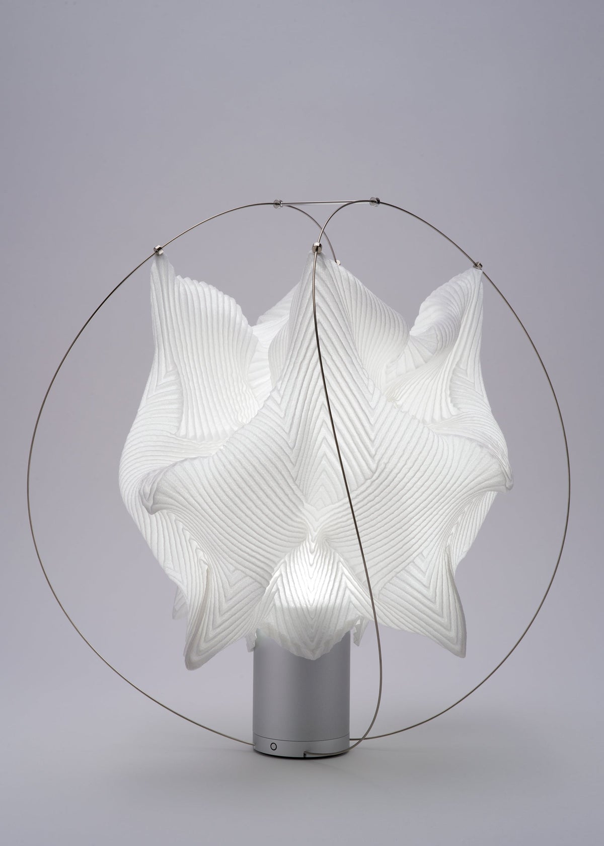 A detail shot of the A-POC ABLE ISSEY MIYAKE TYPE XIII Atelier Oï project lamp.