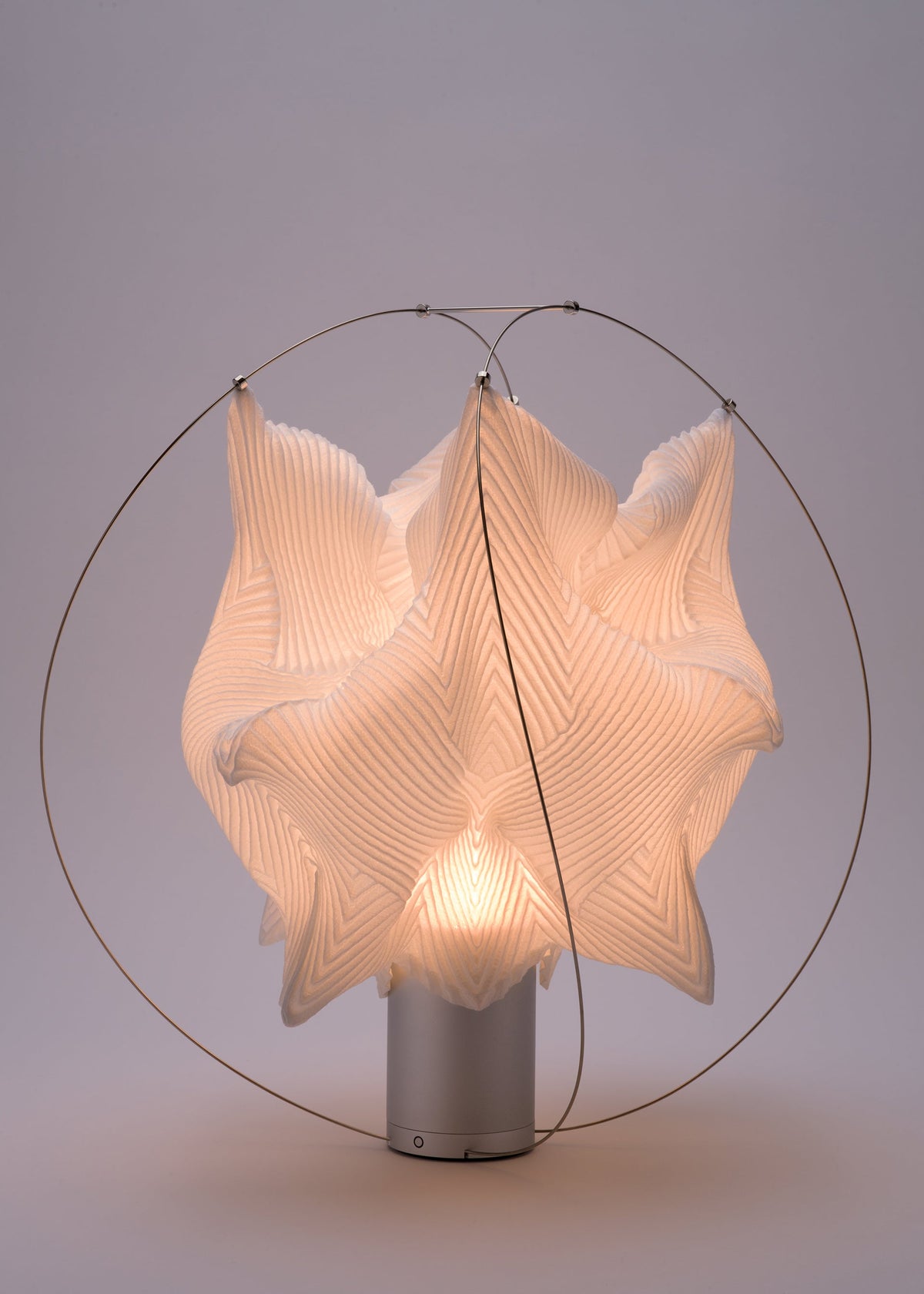 A detail shot of the A-POC ABLE ISSEY MIYAKE TYPE XIII Atelier Oï project lamp.