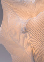 A detail shot of the A-POC ABLE ISSEY MIYAKE TYPE XIII Atelier Oï project lamp.