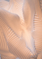 A detail shot of the A-POC ABLE ISSEY MIYAKE TYPE XIII Atelier Oï project lamp.