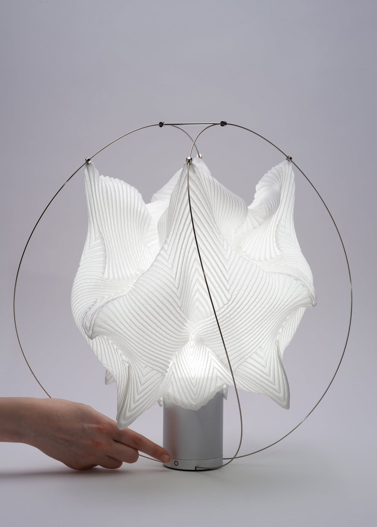 A detail shot of the A-POC ABLE ISSEY MIYAKE TYPE XIII Atelier Oï project lamp.