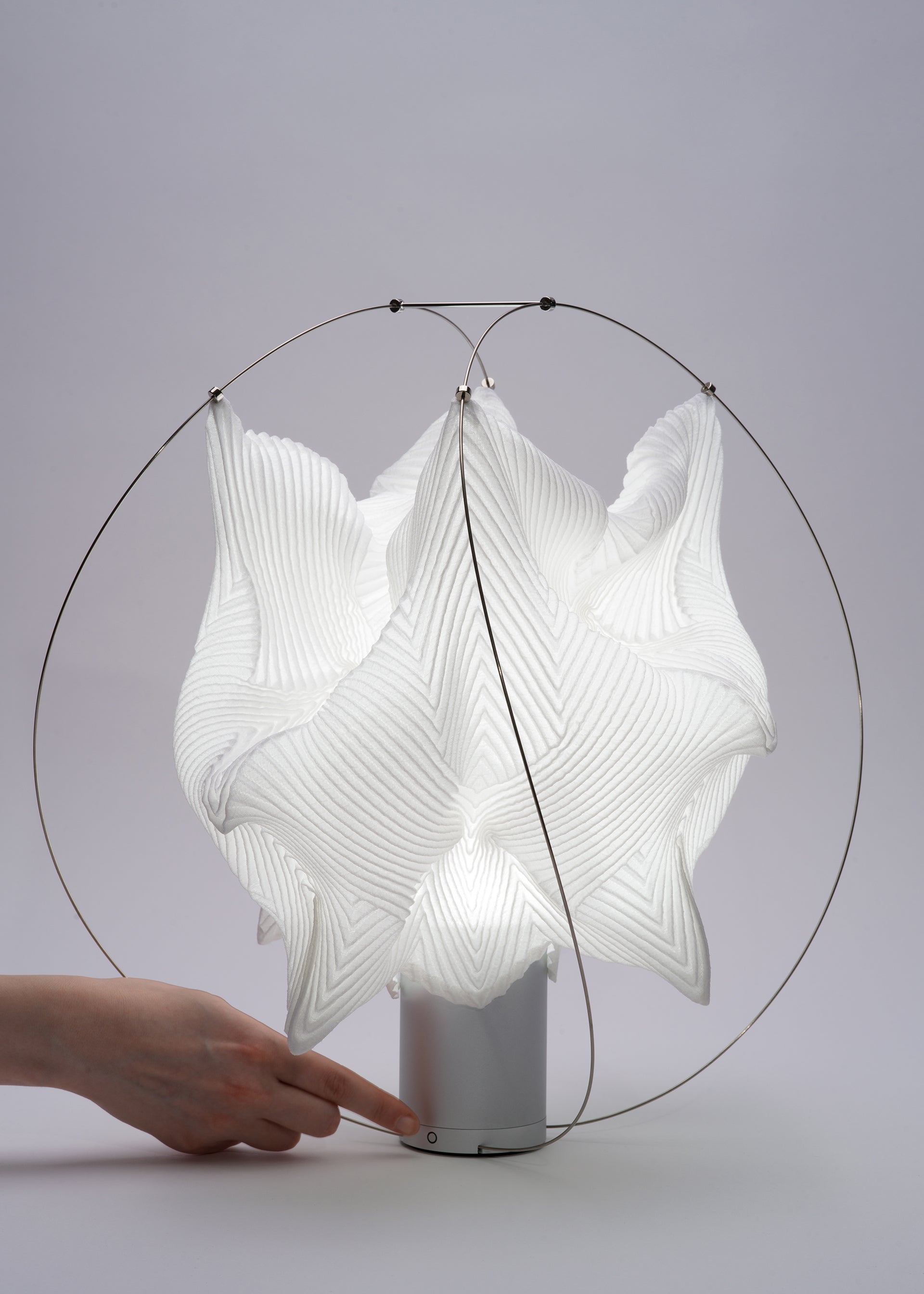 A detail shot of the A-POC ABLE ISSEY MIYAKE TYPE XIII Atelier Oï project lamp.