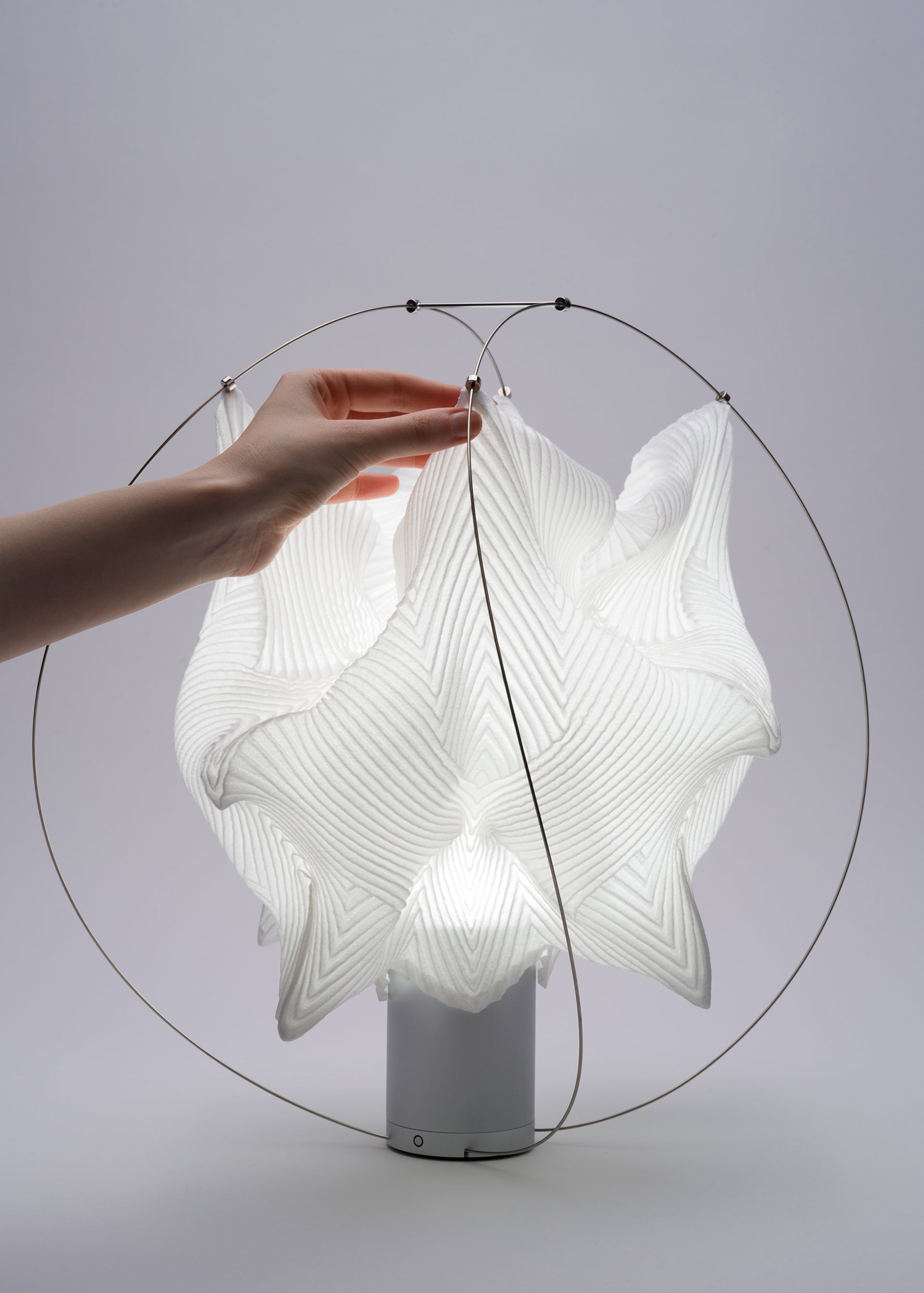 A detail shot of the A-POC ABLE ISSEY MIYAKE TYPE XIII Atelier Oï project lamp.