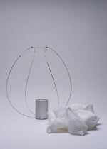 A detail shot of the A-POC ABLE ISSEY MIYAKE TYPE XIII Atelier Oï project lamp.