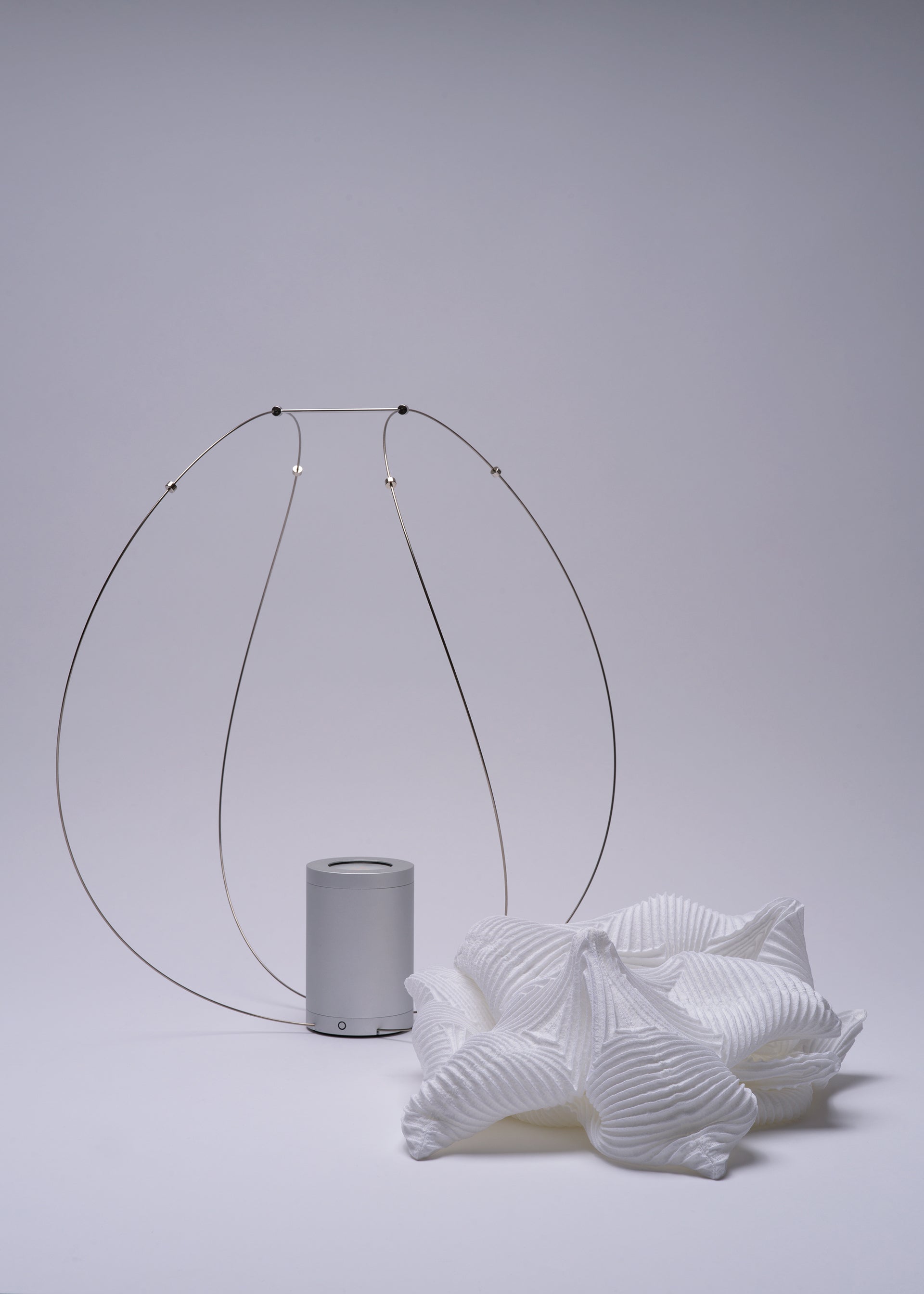 A detail shot of the A-POC ABLE ISSEY MIYAKE TYPE XIII Atelier Oï project lamp.