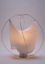 A detail shot of the A-POC ABLE ISSEY MIYAKE TYPE XIII Atelier Oï project lamp.
