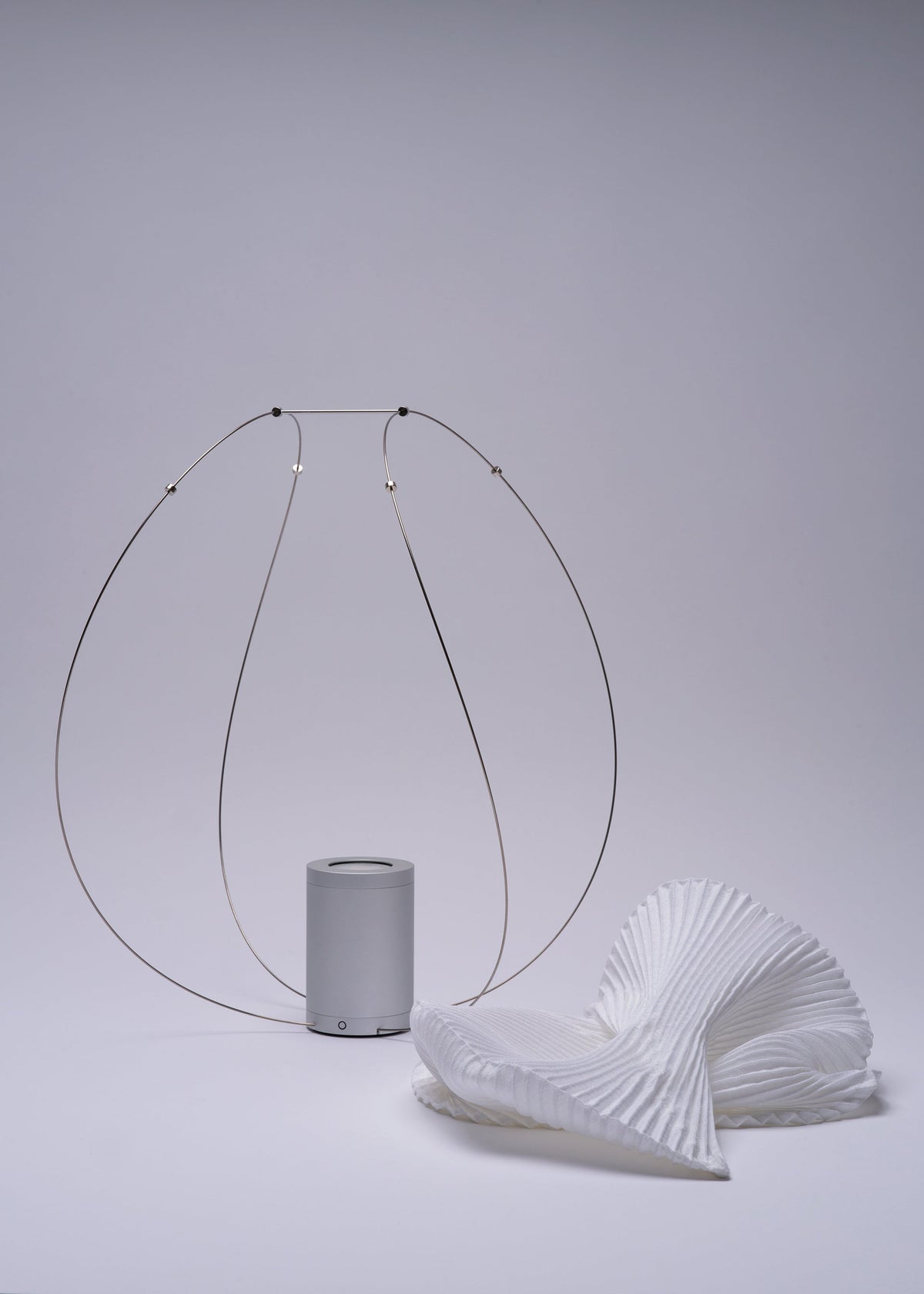 A detail shot of the A-POC ABLE ISSEY MIYAKE TYPE XIII Atelier Oï project lamp.