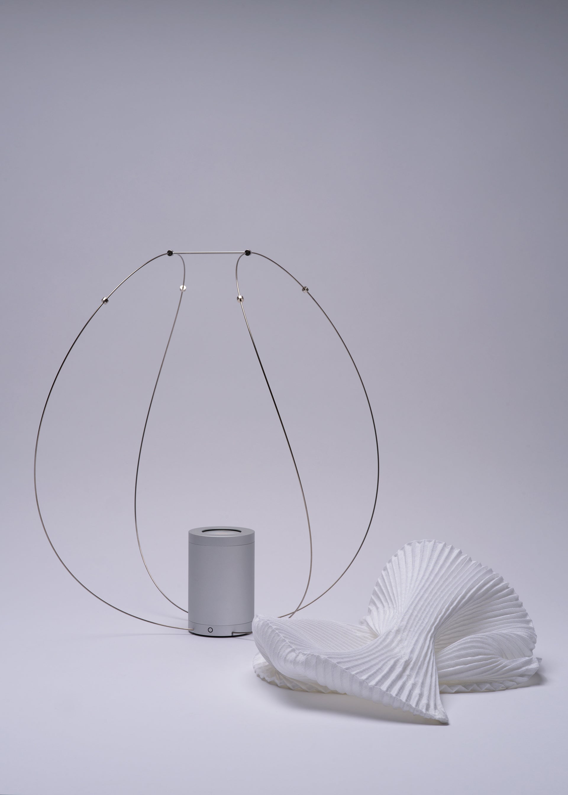 A detail shot of the A-POC ABLE ISSEY MIYAKE TYPE XIII Atelier Oï project lamp.