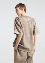 A model wears the A-POC ABLE ISSEY MIYAKE TYPE E 001 trousers.
