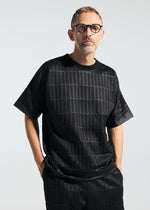 A model wears the A-POC ABLE ISSEY MIYAKE TYPE E 001 top.