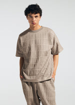 A model wears the A-POC ABLE ISSEY MIYAKE TYPE E 001 top.