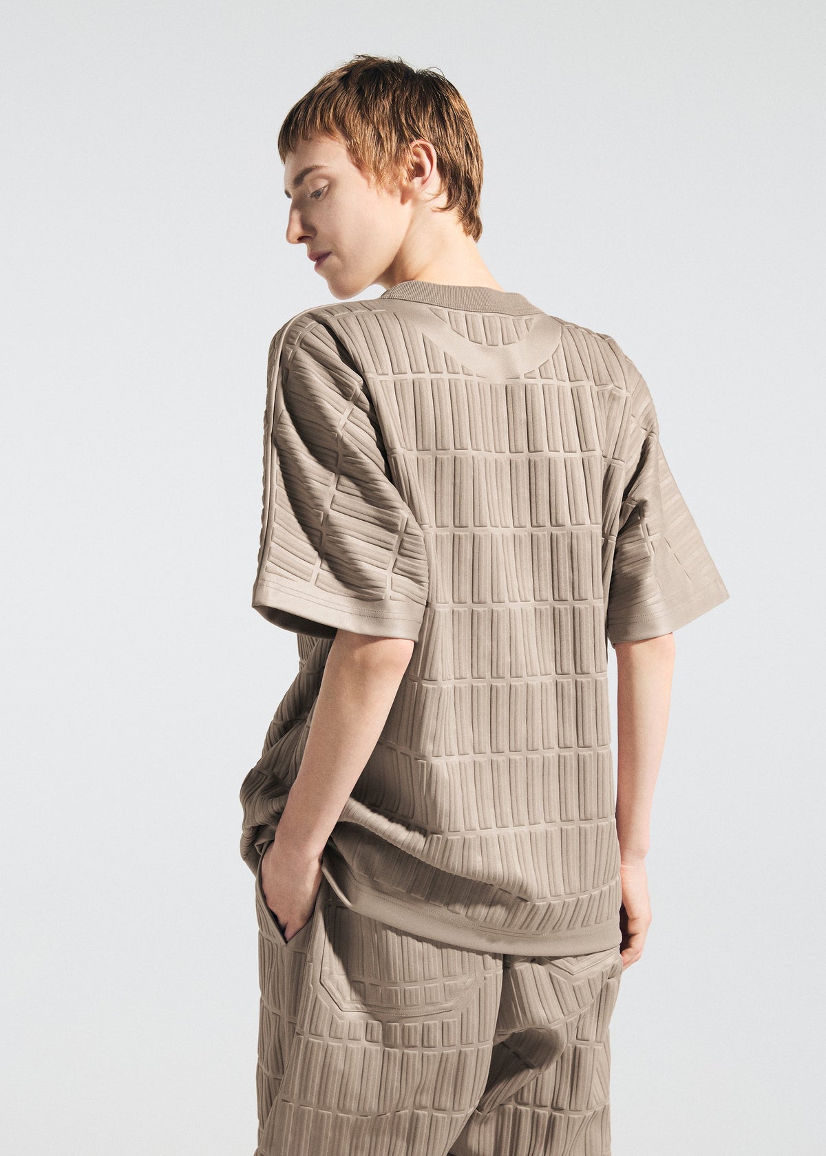 A model wears the A-POC ABLE ISSEY MIYAKE TYPE E 001 top.