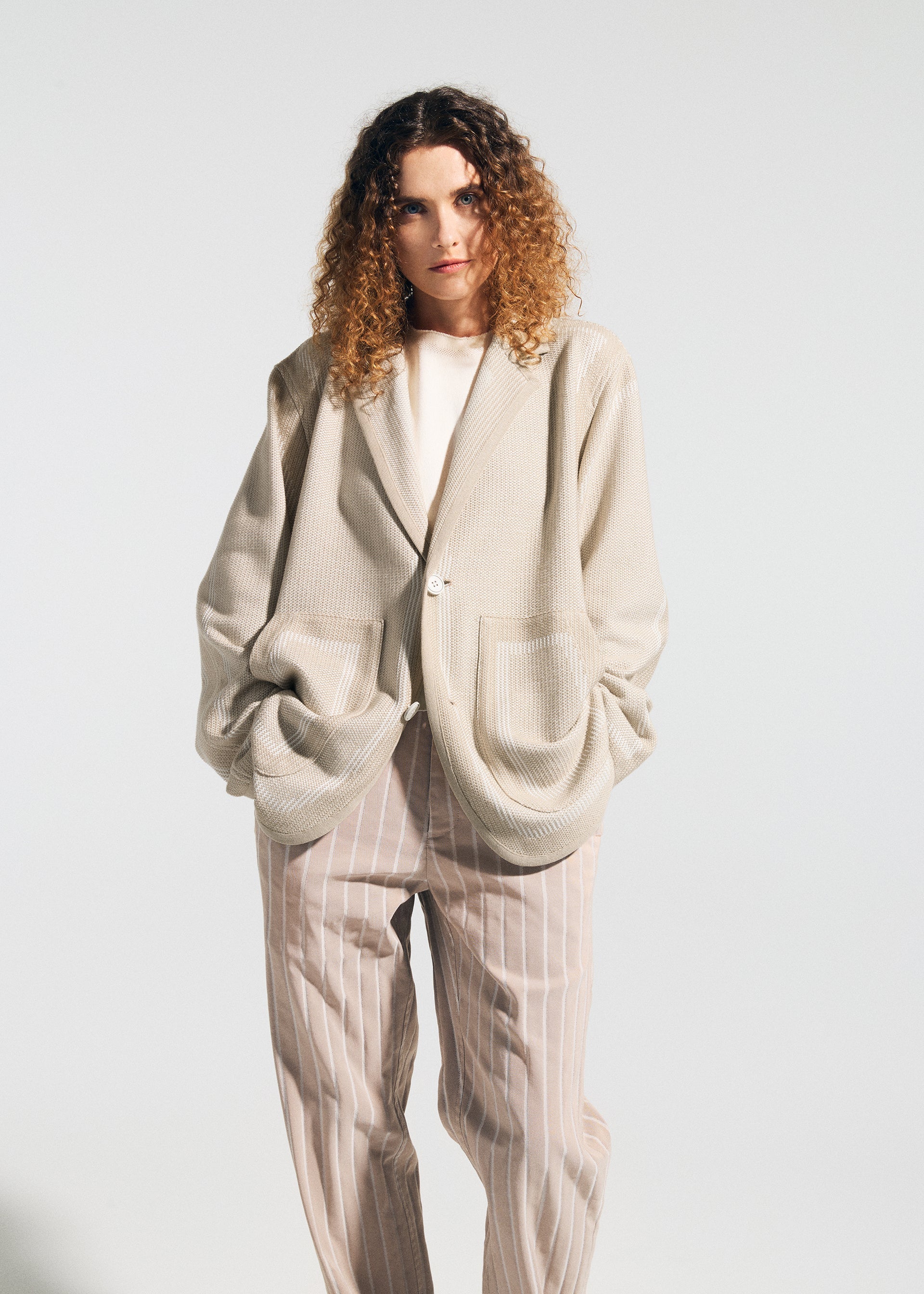 A model wears the A-POC ABLE ISSEY MIYAKE TYPE K 008 jacket.