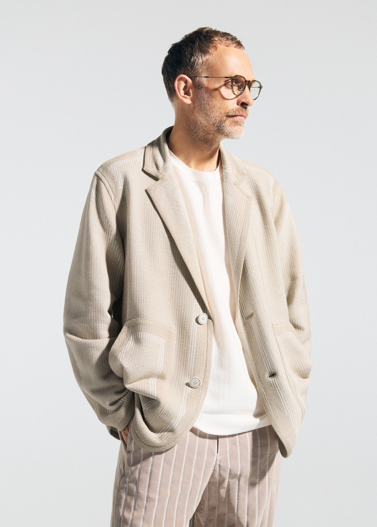 A model wears the A-POC ABLE ISSEY MIYAKE TYPE K 008 jacket.