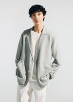 A model wears the A-POC ABLE ISSEY MIYAKE TYPE K 008 jacket.