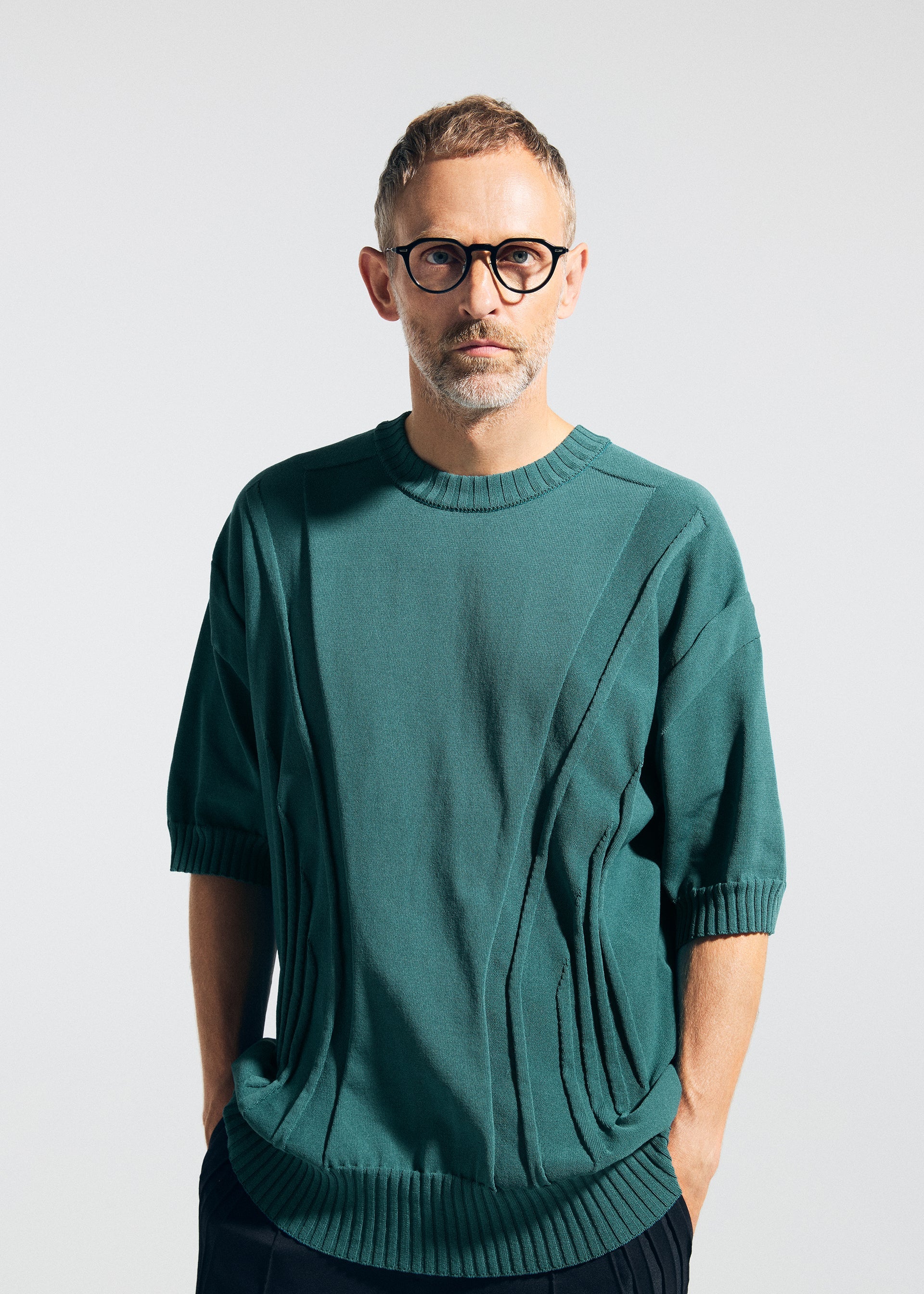 A model wears the A-POC ABLE ISSEY MIYAKE TYPE K 003 1 shirt.