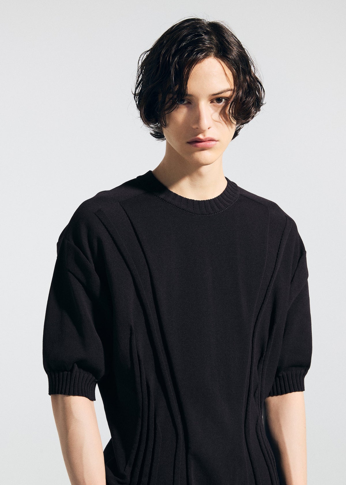 A model wears the A-POC ABLE ISSEY MIYAKE TYPE K 003 1 shirt.