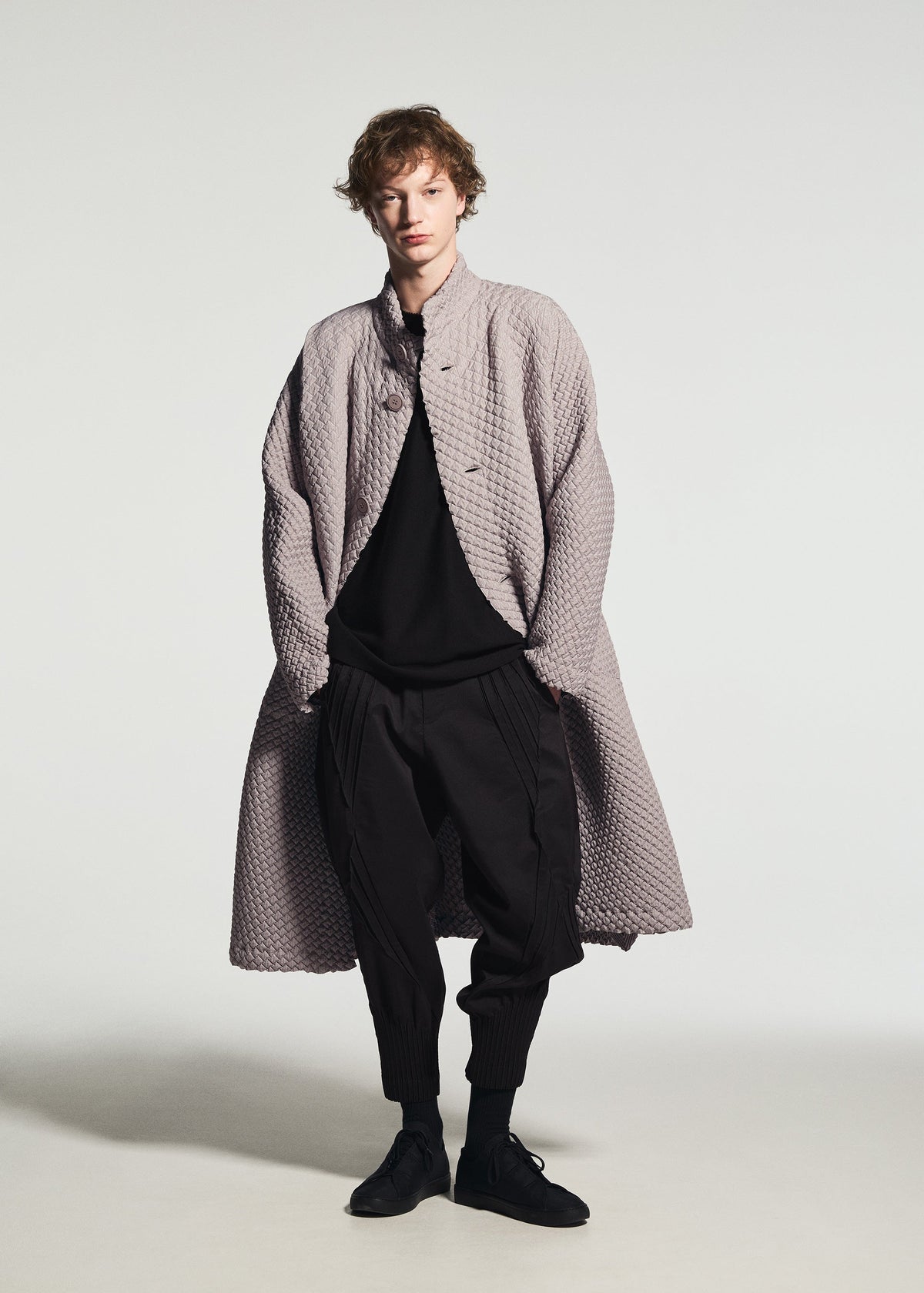 A model wears the A-POC ABLE ISSEY MIYAKE TYPE-O 024 type-o-024-coat-red.