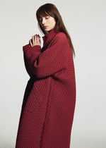 A model wears the A-POC ABLE ISSEY MIYAKE TYPE-O 024 type-o-024-coat-black.